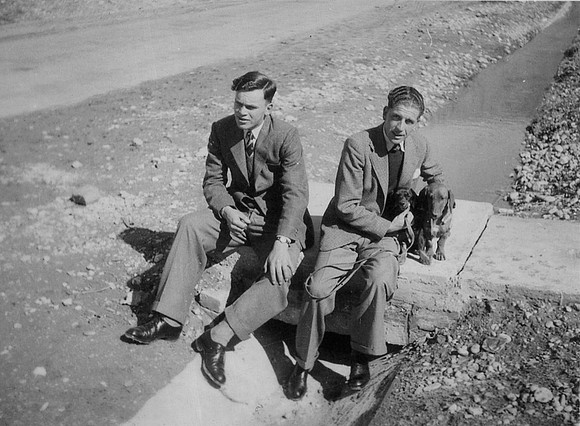 Sitting With Some Dachsunds 1950s