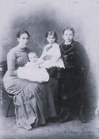 A Victorian Woman With Her Three Children