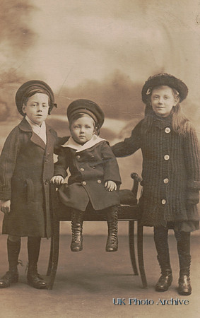 Two Little Boys With Their Sister