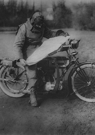 A Motor Cycle Despatch Rider Finding His Way On The Western Front