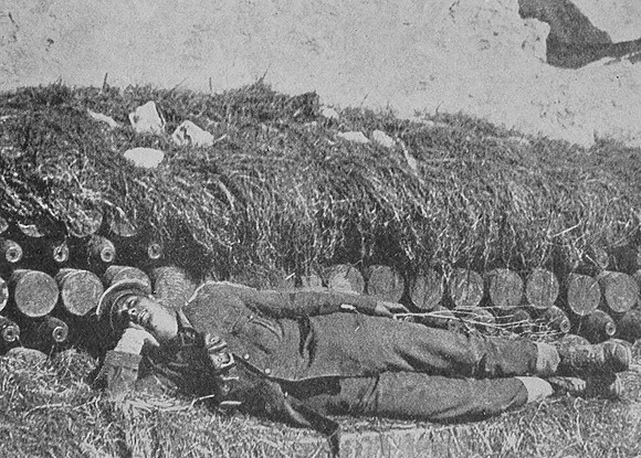 A British Soldier Sleeping On A Bed Of Live Shells