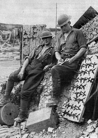 Canadian Soldiers Writing Hoe In A Captured German Trench Next To A Crows Foot A Centruries Old War Implement