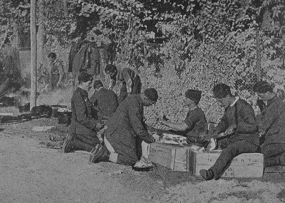 British Soldiers Cutting Up Rations And Cooking