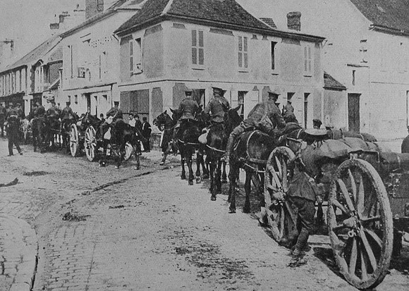 British Artillery Passing Through A Village