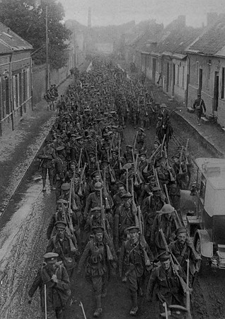 Canadian Troops Marching Through A French Town In 1917