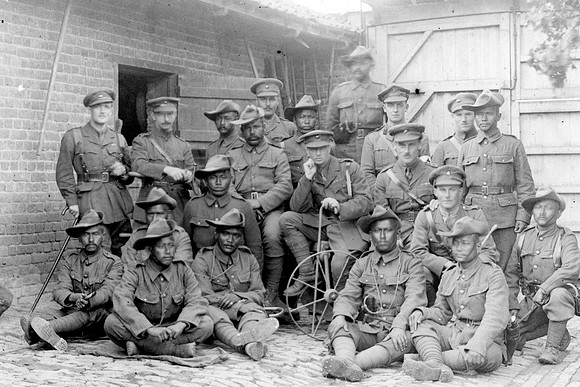 Group of British & Indian officers 1-4th Gurkhas in a French farm house