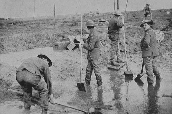 Shovelling Mud Along A Battlefield Road Ypres