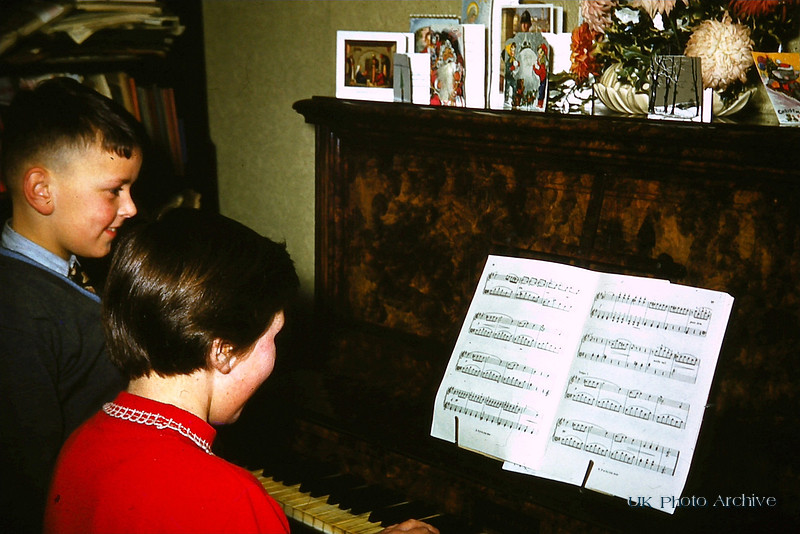 Playing The Piano At Christmas 1950s