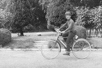 A Boy Cycling In The 1960s