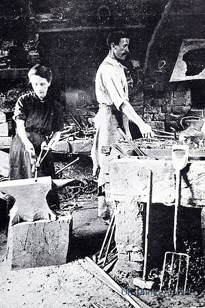 A Woman Working In A Blacksmiths