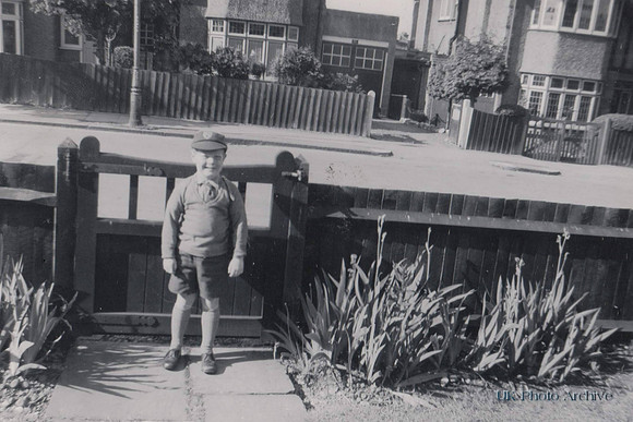 Little Boy In School Uniform At Front Gate c.1950s