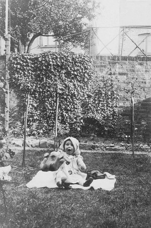 Little Girl Sitting On The Lawn In Garden With A Teddy Bear 1920s