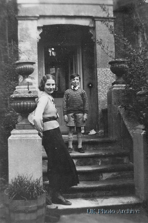 Young Woman With Boy On Steps Of A Large House 1920s