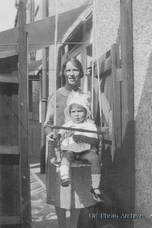 Woman In Back Yard With Little Girl In Homemade Swing 1920s