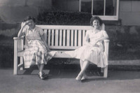 Two Women Sitting On A Bench 1950s