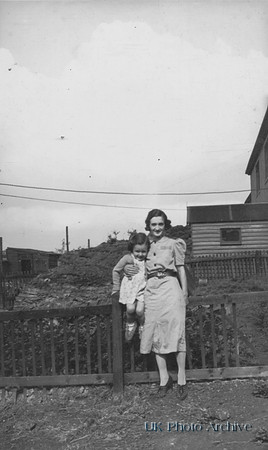 A Woman With A Little Girl At The Garden Gate 1940s