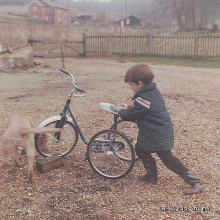 A Little Boy With His Tricycle