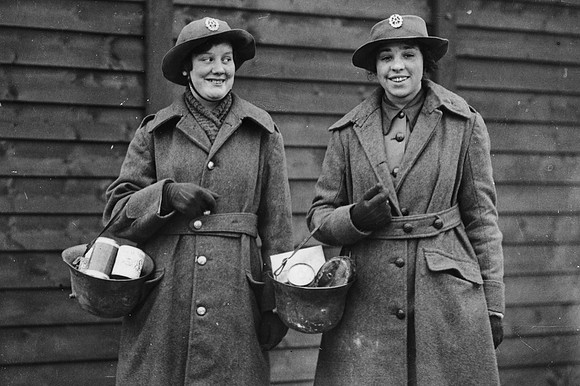 WAAC's in France Finding A Use For German Helmets