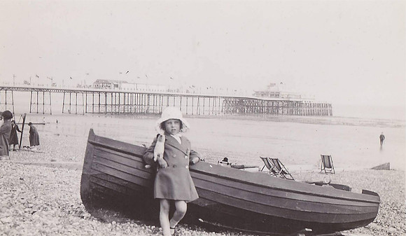Little Girl With A Toy Dog At The Seaside