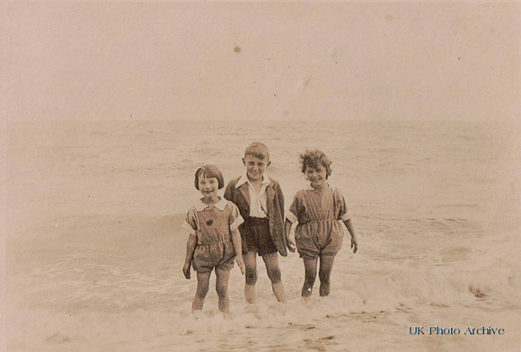 Children Paddling In The Sea In The 1930s