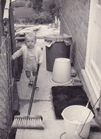 A Little Boy In His Back Garden
