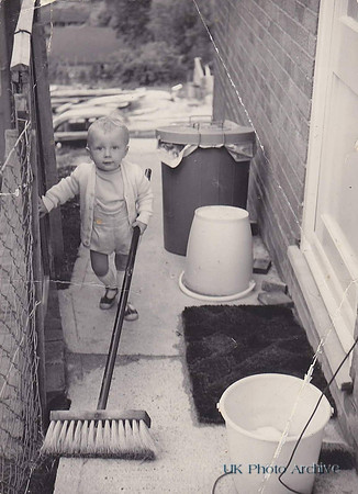 A Little Boy In His Back Garden