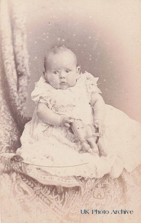 Little Baby Named Madeline Elfrida Wrightson Holding A Toy Horse
