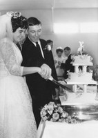 Bride And Groom Cutting Wedding Cake 1960s