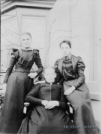 Three Women Outside Their House