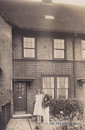 A Couple Outside Their House