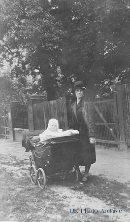 A Woman With A Baby In A Pram 1920s