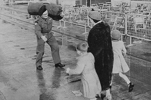 Mrs Swindells With Their Two Children Running To Greet Her Husband After His Return From Korea