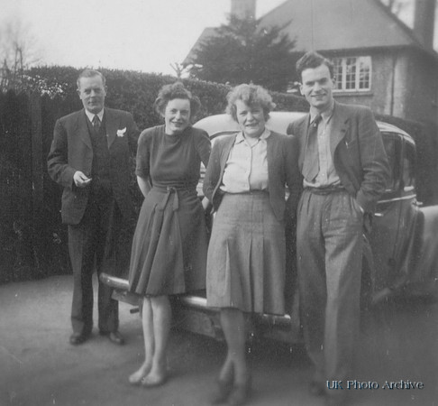 A Family Outside With Their Car