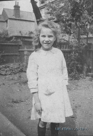A Little Girl In Her Back Garden 1930s