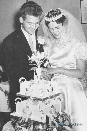 Cutting The Cake At A 1950s Wedding
