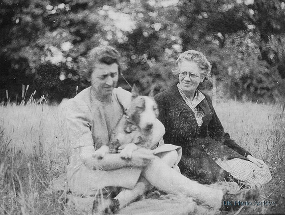 Two Women With An English Bull Terrier