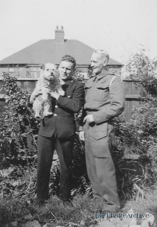 Norton John Roe (Left) With His Pet Dog