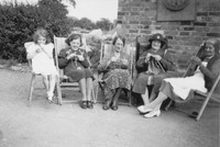 Sheila Roe and Fanny Roe knitiing With Family