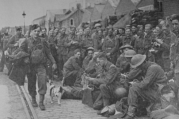 Men Of The BEF Back From France After The Evacuation One Man Leads A Bull Terrier Who Belonged To A Subaltern O The Queens Bays Who Did Not Return