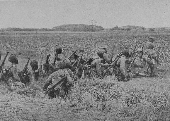 Indian Infantry Advancing Across A Field