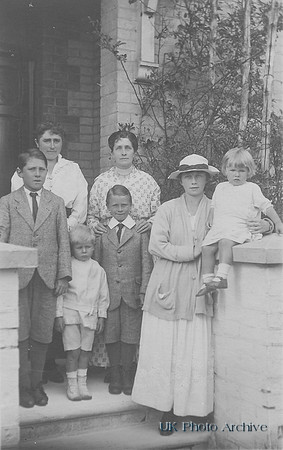 A Family Outside Their House