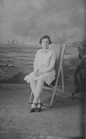 Staged Studio Photo Girl In Deckchair