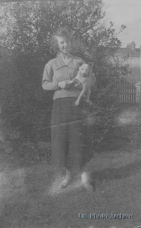 A Woman With A Little Dog
