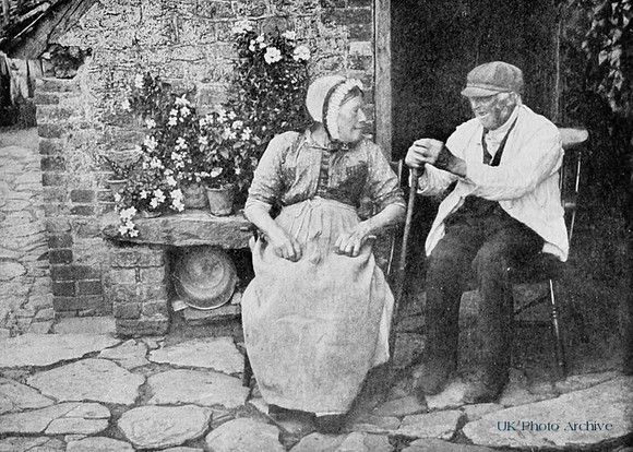 Cottagers Sitting Outside With Their Pots 1904