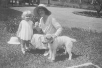 A Woman With A Little Girl And A Dog