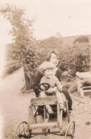 A Little Girl On A Go Kart In The 1930s