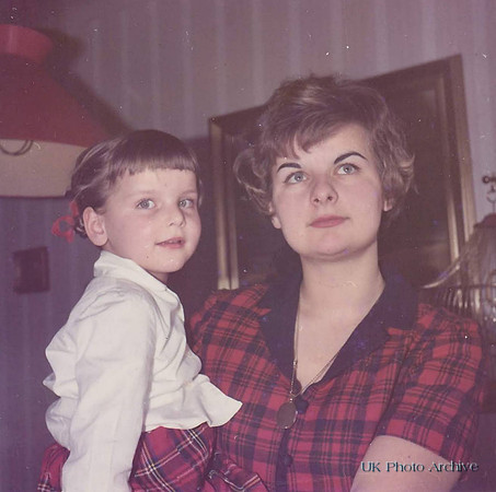 A Woman With A Little Girl