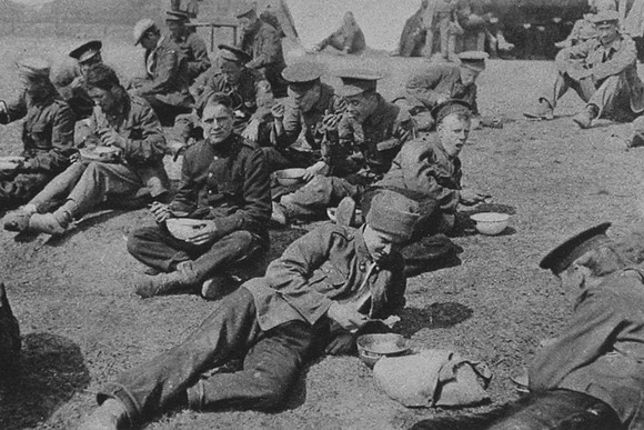 British Prisoners Eating A Meal In A Prisoner Of War Camp