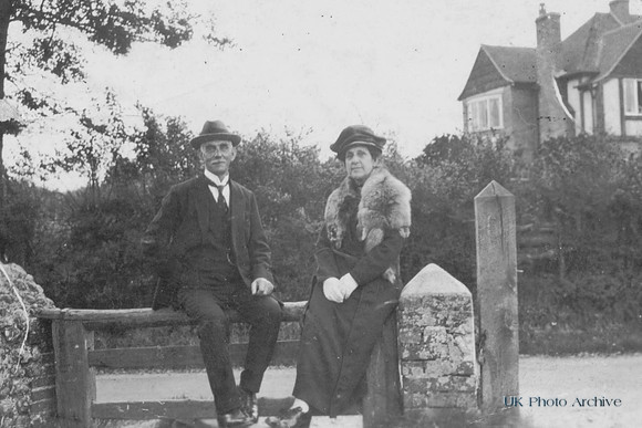 Man And Woman Sitting In Lane Wearing Fox Stole 1930s