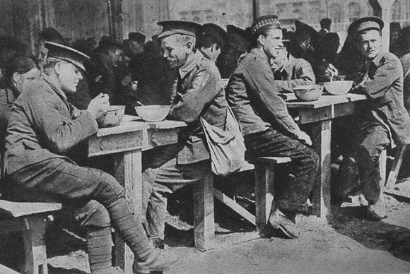 British Prisoners Of War Having A Meal In A Converted Shed